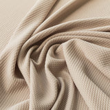 Geometrischer beigefarbener Jacquard-Strickstoff - Ribes y Casals