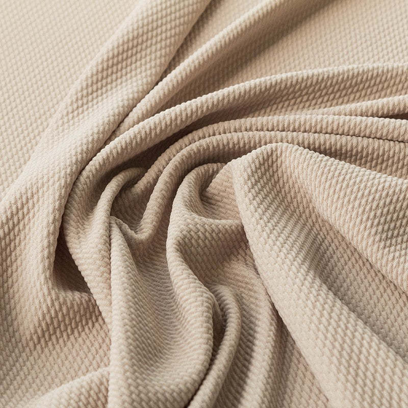 Geometrischer beigefarbener Jacquard-Strickstoff - Ribes y Casals