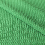 Geometrischer grüner Jacquard-Strickstoff - Ribes y Casals