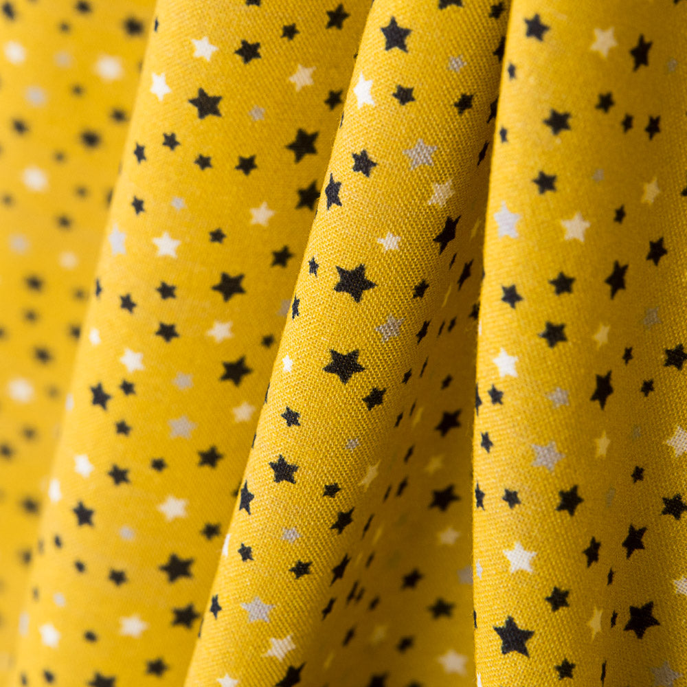 Multi-Star Cotton Ochre Hintergrund - Ribes y Casals